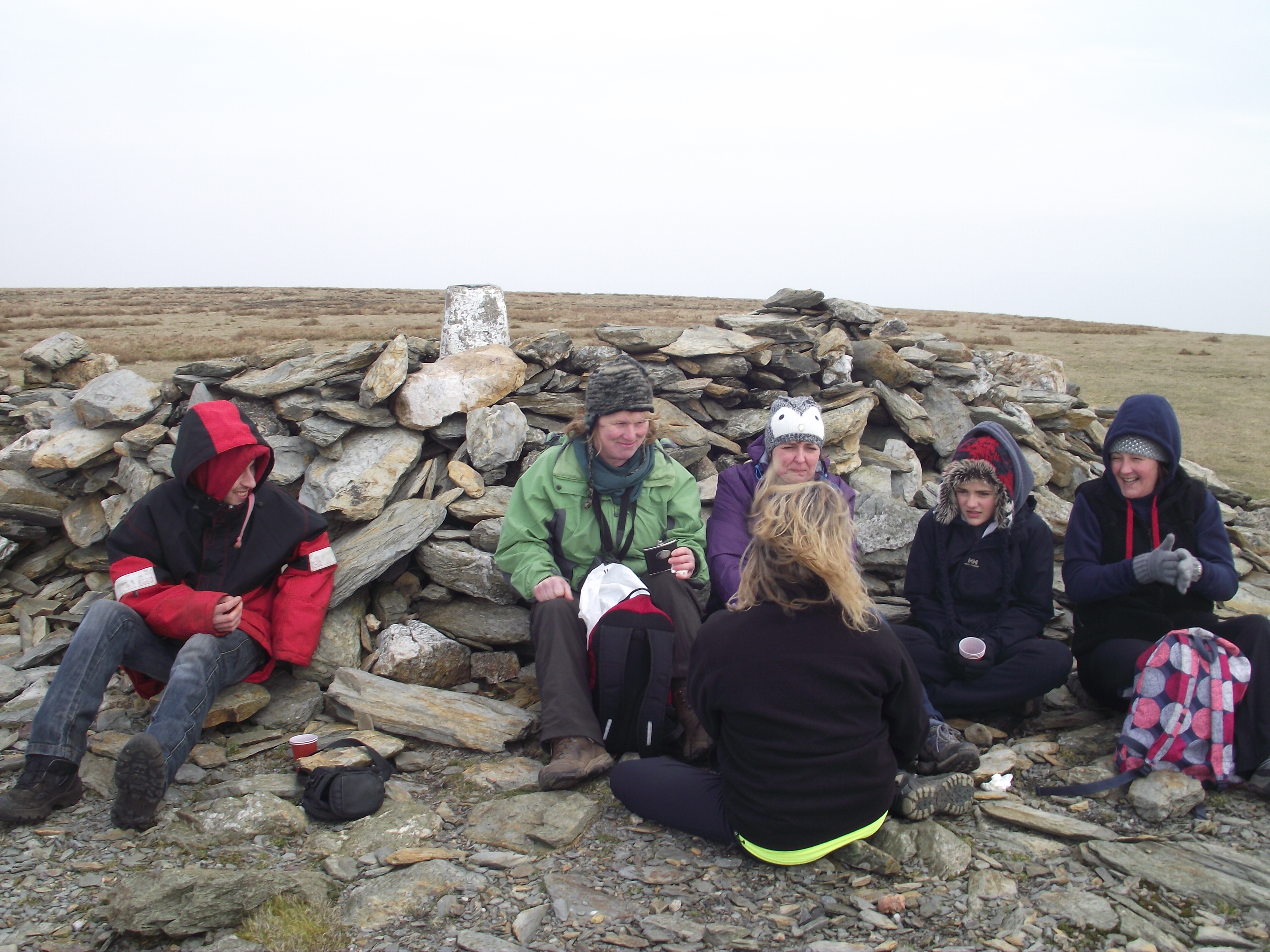 Huddled at the top of Black Combe sharing some of Cally's 1967 Damson Gin